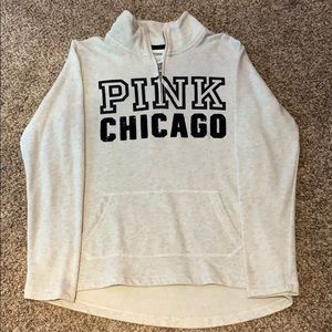a creme colored PINK quarter zip